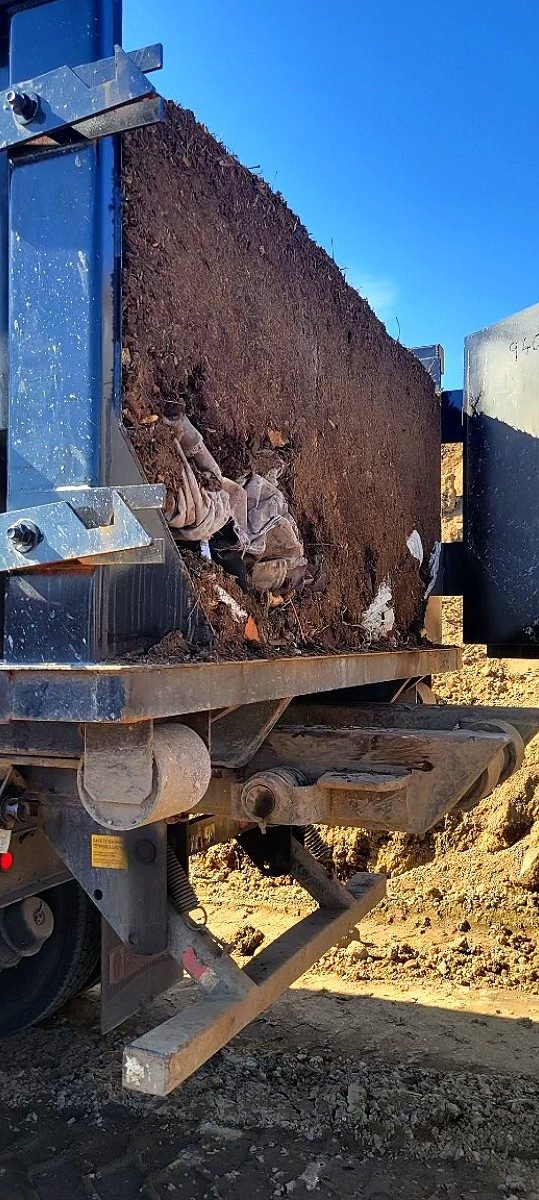 Tennessee Valley Waste & Container Services heavy construction dumpster on job site in Huntsville